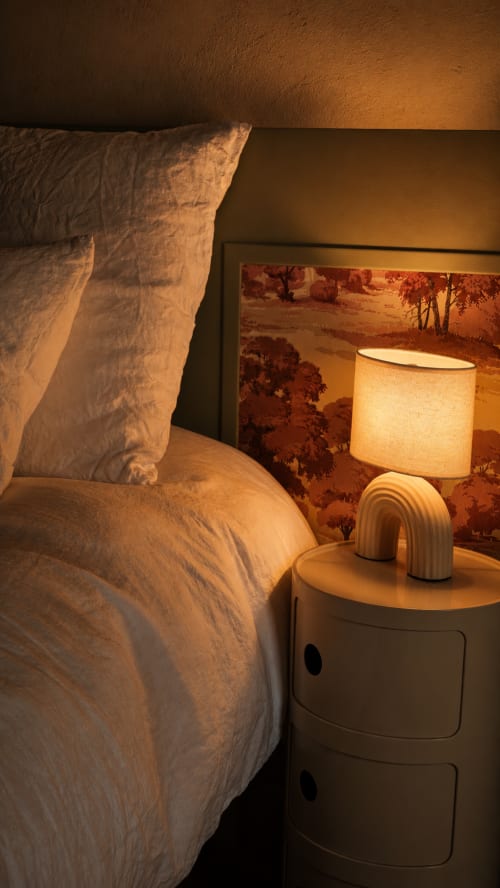 Cozy bedroom at La Maison 1903 B&B in Trévou-Tréguignec with warm lighting and minimalist nightstand décor