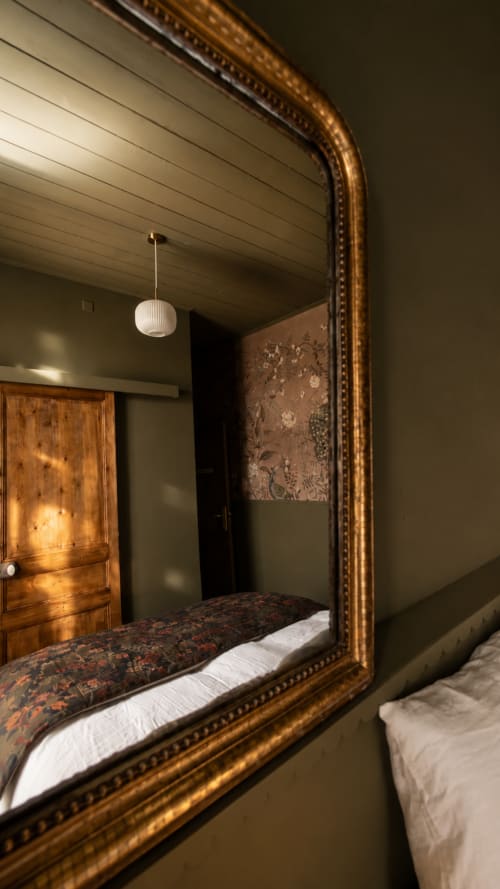 Mirror reflection of bed in Peacock room at La Maison 1903 B&B, Trévou-Tréguignec, Brittany