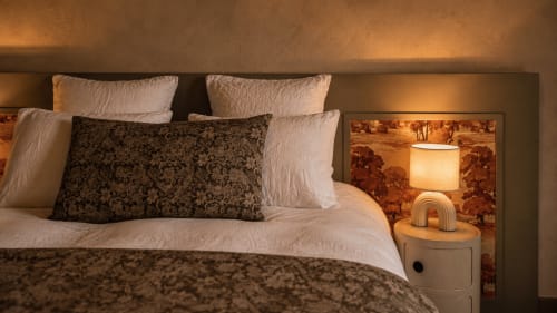 Cozy bedroom at La Maison 1903 B&B in Trévou-Tréguignec with garden view and warm lighting