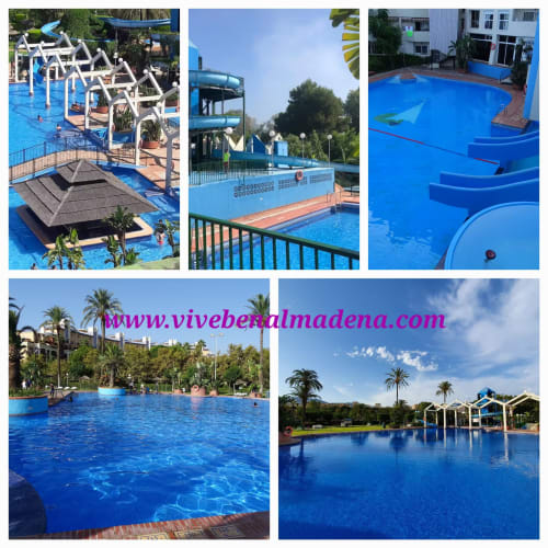 VIVE Benalmádena resort pools with blue water, slides, palm trees, and relaxation areas in Spain