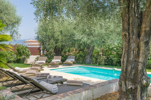 Private pool with loungers and olive trees at Villa M de Mas, luxury accommodation in Grasse near Cannes