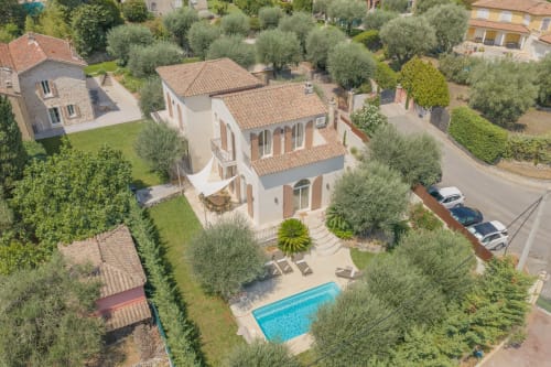 Aerial view of Villa M in Grasse with private pool, terrace, and surrounding olive trees