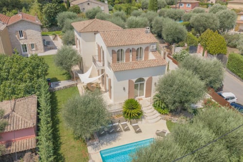 Aerial view of Villa M de Mas with private pool, terrace, and surrounding olive trees in Grasse, France