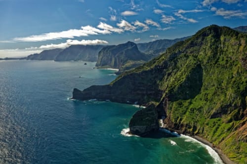 Dramatic coastal cliffs and turquoise waters near Arco da Calheta, Portugal - BHF Residences location