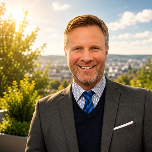 Property manager for Mattbnblux1 hotel in Luxembourg smiling outdoors with city vista backdrop