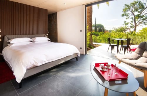 Junior Suite Bestouan at Villa Annette in Cassis with sea view, modern bed, lounge area, and terrace overlooking