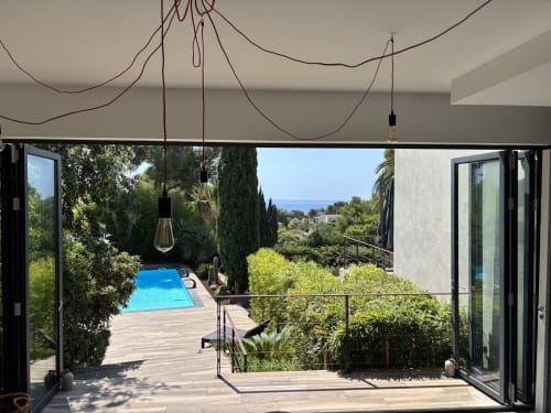 Villa Annette Cassis: Spa room terrace overlooking pool, sea view, cypress trees and coastal landscape