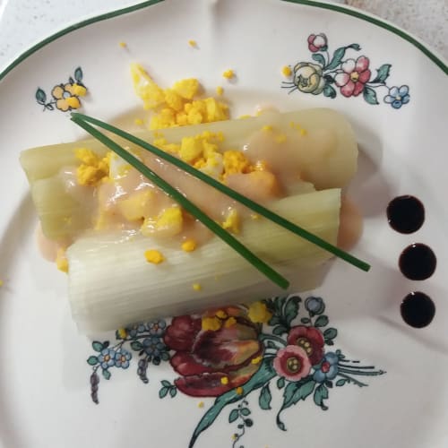 Elegant plated leek dish with corn at Les Gravets B&B in Sigalens