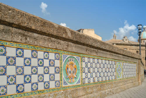 Colorful ceramic tile decoration on stone wall in Caltagirone, Sicily landmark