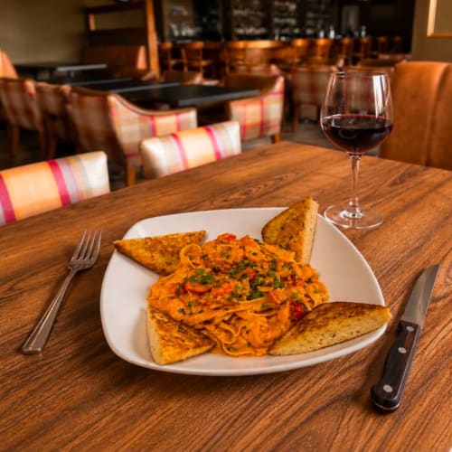 Pasta with shrimp and glass of red wine at Sliabh Beagh Hotel in Monaghan, Ireland