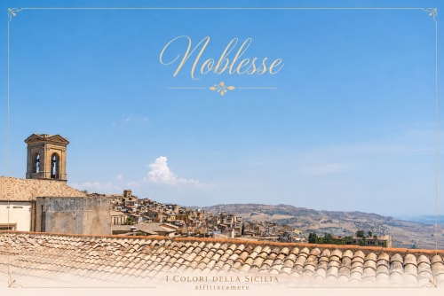 Caltagirone hilltop town with terracotta roofs and church tower, I colori della Sicilia boutique hotel