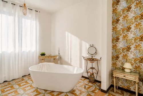 Luxurious freestanding bathtub in bright bathroom at I colori della Sicilia B&B in Caltagirone, Sicily