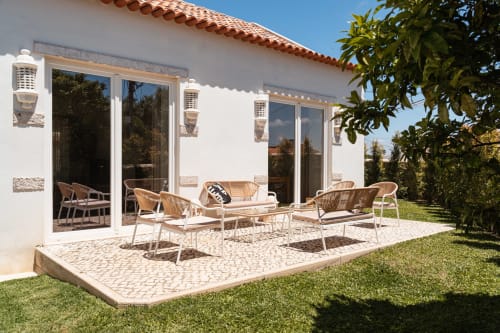 Sea'Ya Villa Juso terrace with modern outdoor furniture, patio, manicured garden, and mountain views
