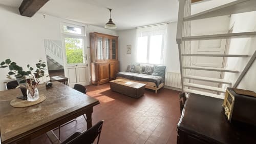 Le Chambre du Fournil at Le Gite De Saint Phal: bright studio with dining table, bed, sofa, and rustic beams in Saint-Phal