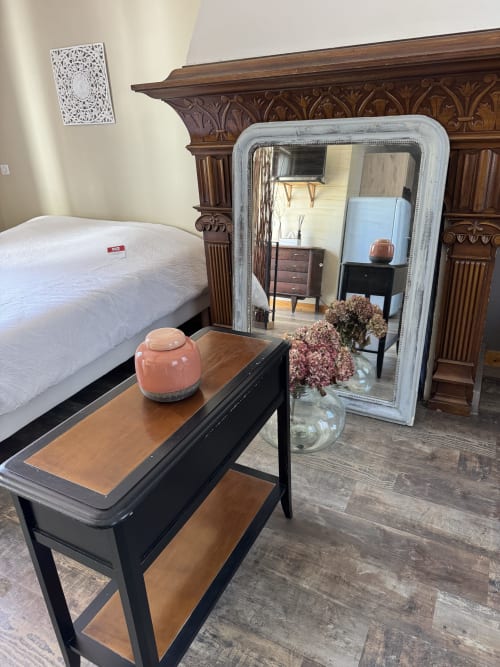 Suite Magnolia cottage bedroom at Au Bois Dormant, Hesdin-la-Forêt, with ornate headboard and garden view