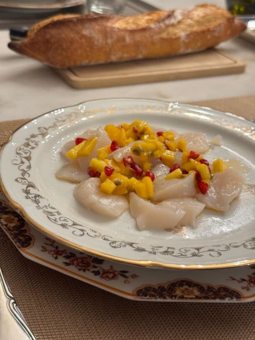 Elegant plated scallops with corn and red pepper garnish, fresh baguette at Au Bois Dormant, Hesdin-la-Forêt
