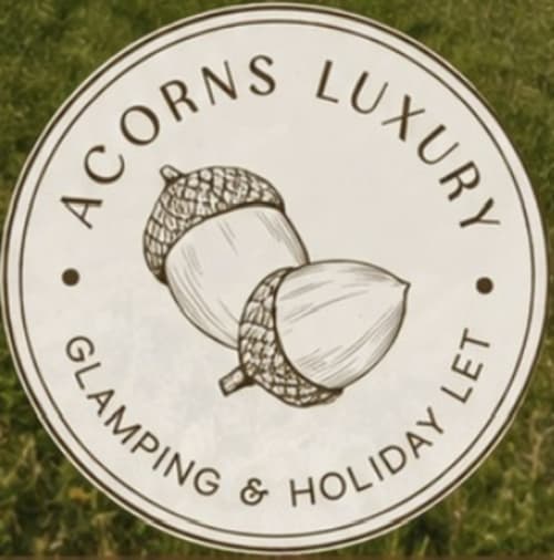 Acorns Luxury Glamping logo featuring acorns with caps, Holywell, Wales