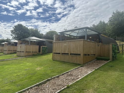 Ladybird Pod at Acorns Luxury Glamping in Holywell with hot tub, wooden structure and manicured grounds