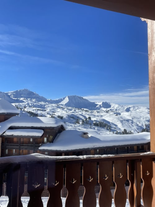 Snow-covered Alpine balcony with mountain views at Le Chalet des Cimes, Belle Plagne