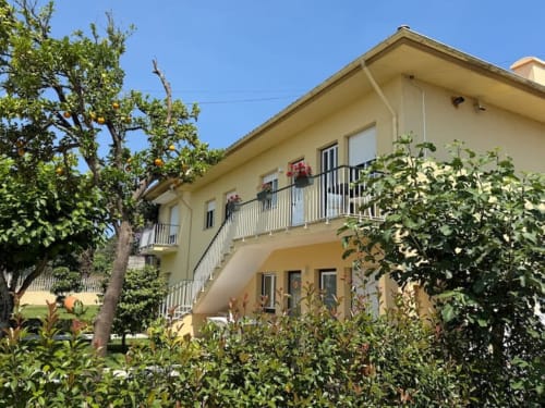 Yellow apartment with balconies and lush garden, peaceful retreat near Porto, Chaves Portugal