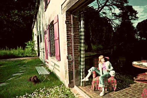 France Gall relaxing seated in an armchair behind the picture window at the Domaine de l'Ocrerie in Pourrain France