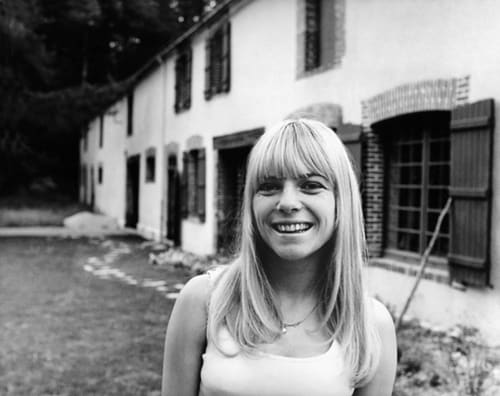 A smiling France Gall in the 1960s in front of L'Ocrerie, Pourrain, France,