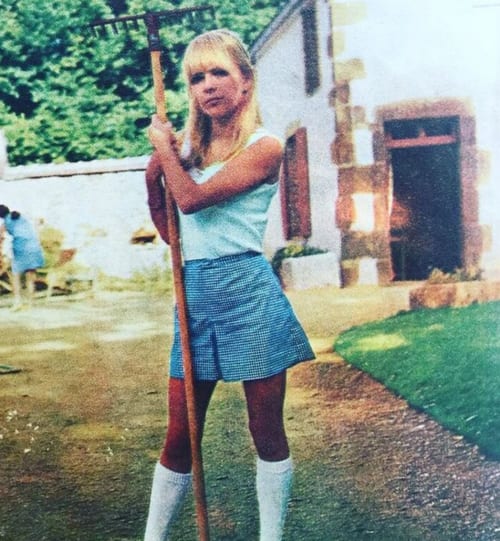 France Gall holding a rake in the garden of L'Ocrerie in Pourrain, France.