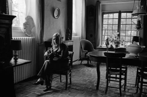 France Gall playing the guitar in the living room of L'Ocrerie in Pourrain, France.