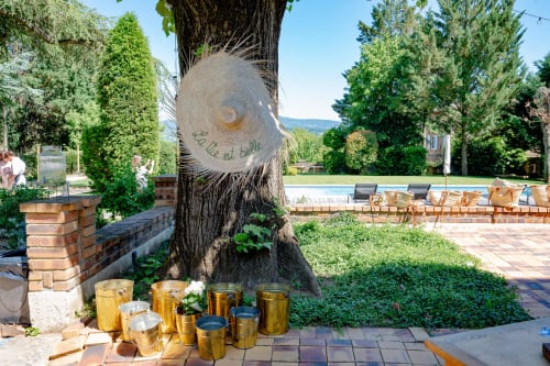 Ancient tree with carved welcome message at La Maison & l'Orangerie B&B in Saint-Jean-des-Vignes, France