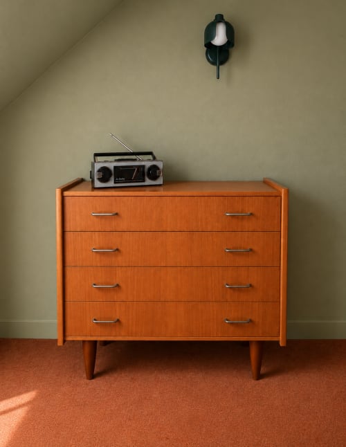 Mid-century orange dresser with vintage radio in La Léonie room at Au Bon Séjour hotel