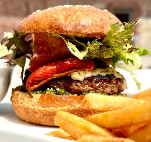 Gourmet burger with red peppers and greens, served with fries at B&B Sens'UP near Pairi Daiza, Brugelette