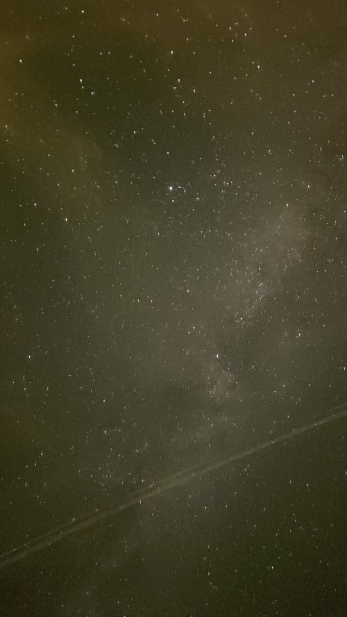 Starry night sky above Château de Vaux Morvan in Étang sur Arroux, France