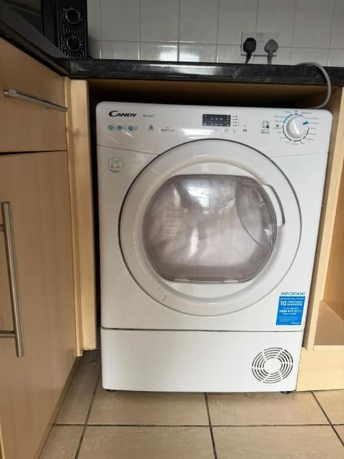 White Candy Smart tumble dryer in modern kitchen at Catherines House Kings Cross, London