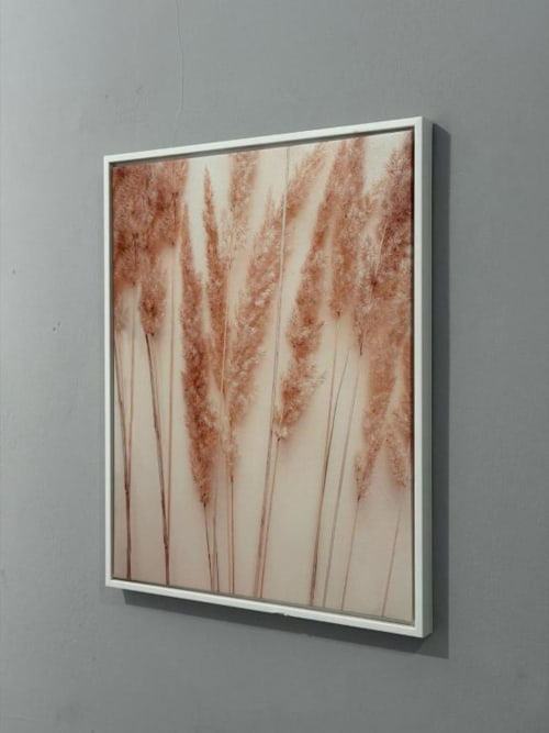 Framed botanical artwork featuring dried pampas grass in warm terracotta tones, decorative wall art in Room 5 at Catherines