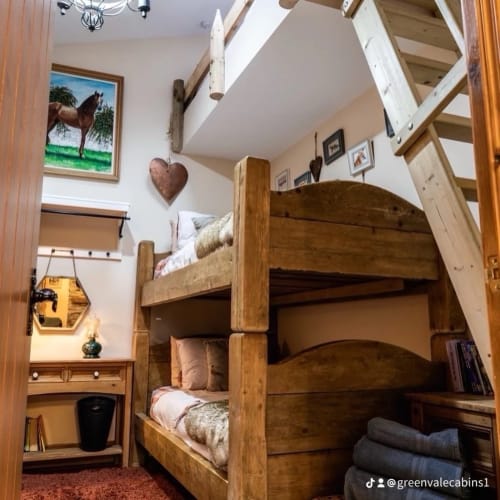 Rustic wooden bunk beds in Colorado Apartment at Greenvale Cabins, Newry, with mountain decor and cozy furnishings