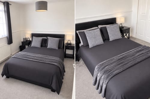 Modern double bedroom at Eden Stays Coventry with black bed, gray pillows, bedside lamps, and neutral décor