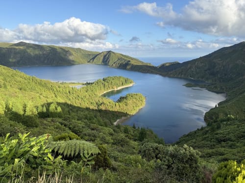 Twin crater lakes surrounded by lush forests and green mountains near Golden Mermaid Villa in Ribeirinha, Azores
