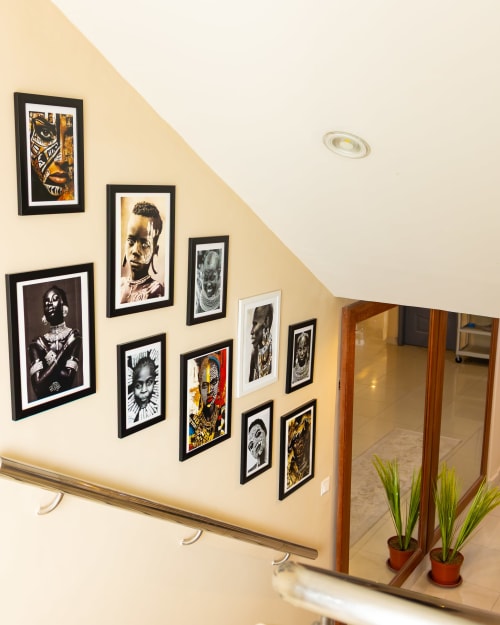 Gallery wall of African art portraits at The Africa Reach boutique hotel in Accra, Ghana