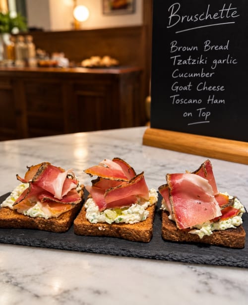 Bruschette al prosciutto Toscano, formaggio di capra e cetriolo da Porta Tosa Milano