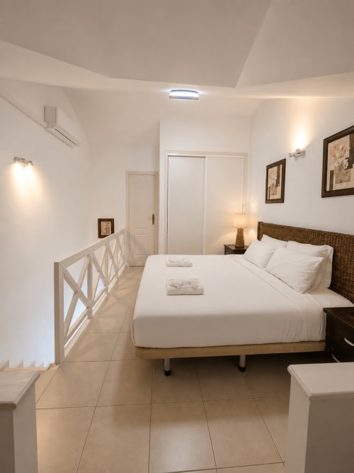 Modern duplex bedroom at Manage Home Tenerife in Playa de Las Americas with pool view, queen bed, and contemporary