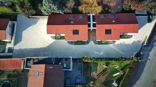 Aerial view of Résidence des Sables in Mably, France showing red-roofed apartments surrounding an inner courtyard