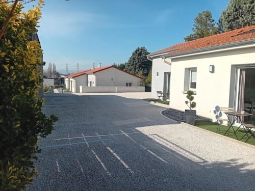 Modern apartment with terrace at Résidence des Sables, Mably. Ground-floor unit with courtyard view, furnished patio, and