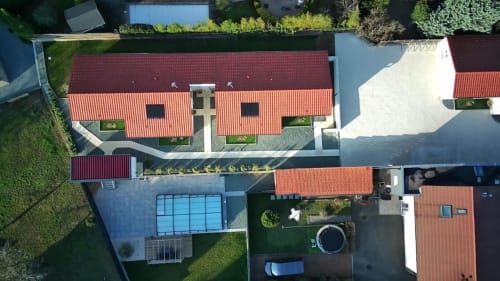 Aerial view of Résidence des Sables in Mably showing red-roofed buildings, courtyard, and manicured grounds