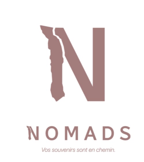 NOMADS EN BORD DE MER hotel logo featuring stylized N and W with tagline in Lomé, Togo
