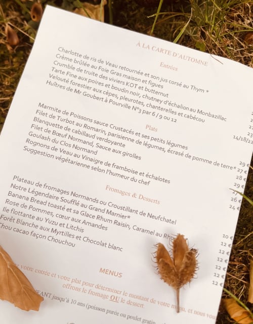 French autumn menu from Le Clos Normand in Normandy featuring entrées, plats, and desserts on white paper with fall leaves
