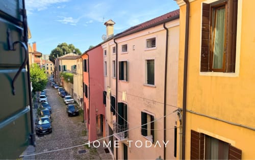 Colorful historic buildings on narrow Padova street, Hometoday apartment in centro storico