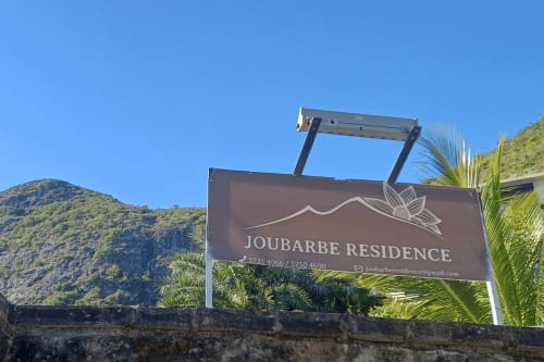 Joubarbe Résidence sign with mountain view in Moka, Mauritius - BnB property entrance