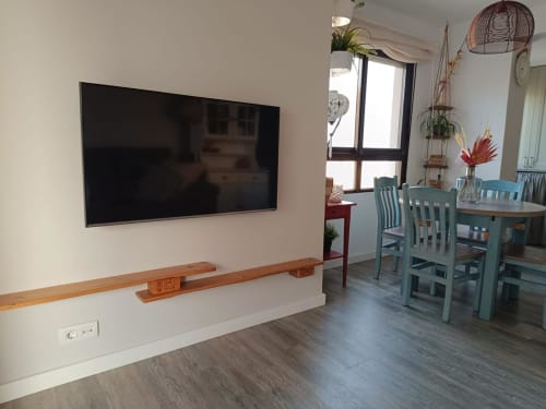 Modern apartment living room at Mediterranea Sunny Keys with flat-screen TV, dining area, sea views, and contemporary