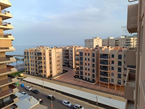 Benicàssim beachfront apartments with sea views, modern residential complex at sunset