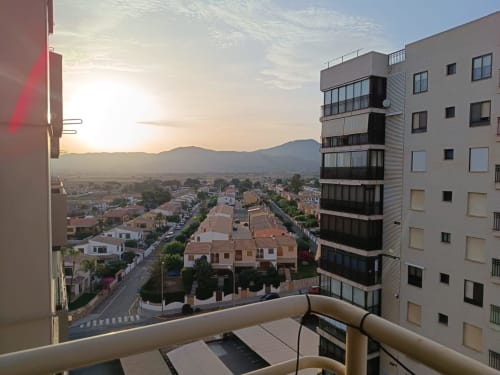 Sunset balcony view of Benicàssim town and mountains from Riviera Sunny Flat apartment